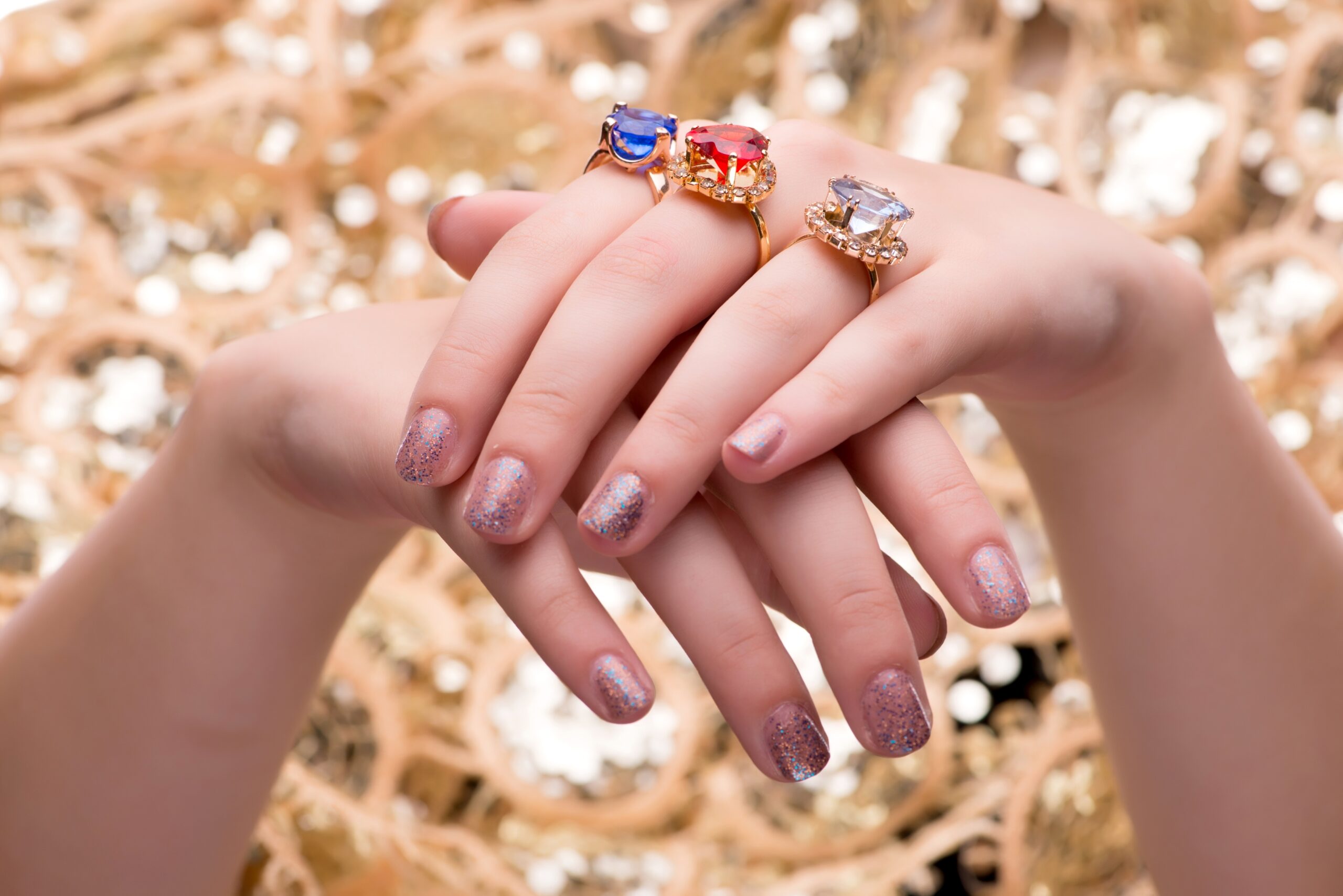 Woman showing off her jewellery rings in fashion concept